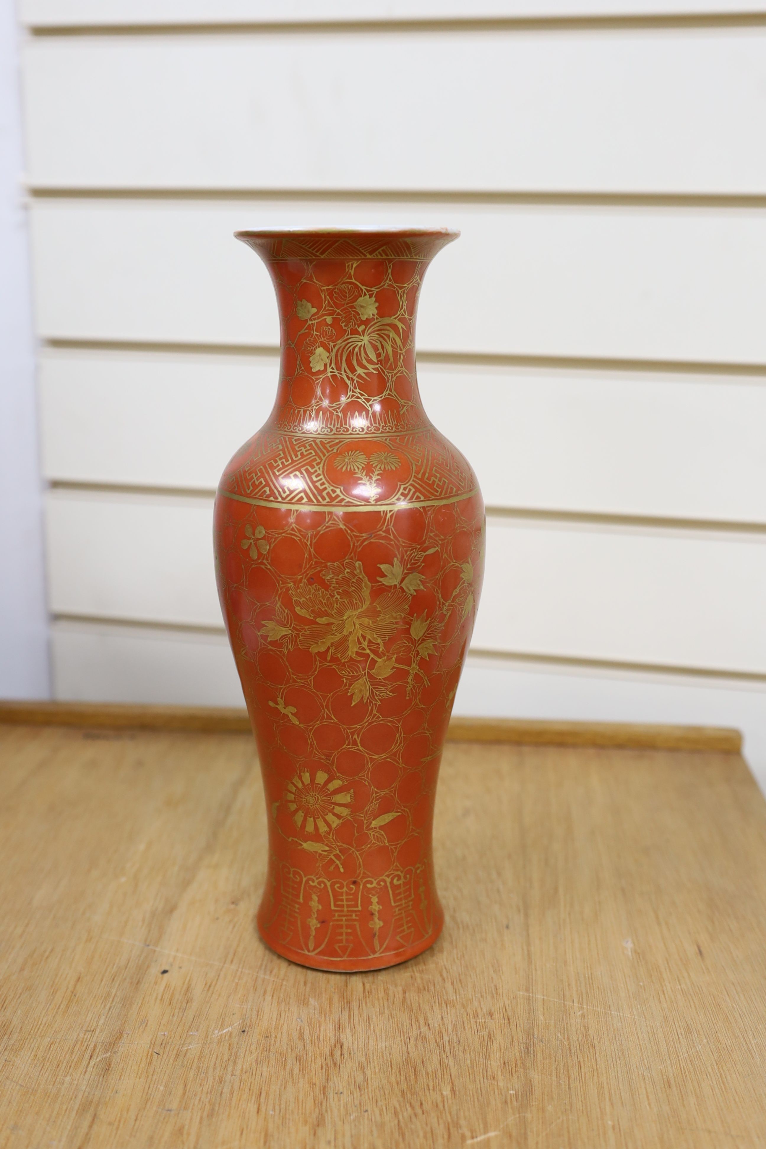 A Chinese blue and white gourd vase with landscape decoration, a similar blue and white sleeve vase and a Japanese Kutani vase